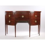 Regency mahogany bowfront sideboard, the bow front top above three deep drawers and tapering legs,