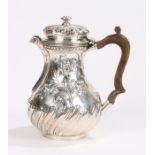 Victorian silver hot water jug, London 1892, maker Susannah Brasted, with swirled gadrooned lid,