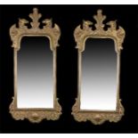 Pair of 19th Century gilt gesso mirrors each surmounted by a feather and eagles heads with scroll