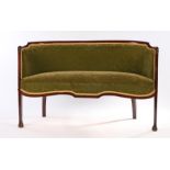 Edwardian parlour settee, the bow pad back with a stuff over seat raised on tapering legs