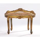 19th Century gilt wood stool, the bow back with a flower carved gallery above shell capped