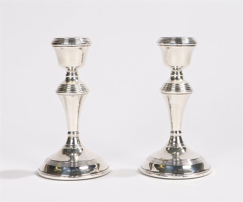 Pair of Elizabeth II silver candlesticks, Birmingham 1968, maker W I Broadway & Co, with reeded