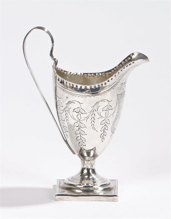 George III silver milk jug, London 1795, makers mark rubbed, the helmet form jug with reeded loop