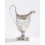 George III silver milk jug, London 1795, makers mark rubbed, the helmet form jug with reeded loop