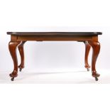 Victorian style mahogany extending dining table, with chamfered frieze, on cabriole legs and