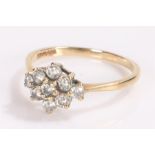 9 carat gold ring, set with a flower head design, ring size M