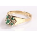 9 carat gold emerald set ring, in a flower head design, ring size P