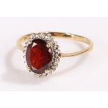 9 carat gold garnet set ring, with a central garnet, ring size P