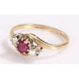 9 carat gold ruby and diamond ring, with a central ruby flanked by diamonds, ring size N