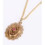 9 carat gold chain and pendant, the chain with clip and pendant with central red stone,
