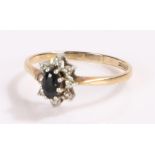 9 carat gold sapphire ring, with a flower head design, ring size L
