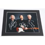 Studio portrait of Crosby, Stills and Nash, 10 x 8 colour close-up photo signed by all three in