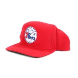 Ed Sheeran's baseball cap, Philadelphia 76ers, in red with badge to the front . All of the Ed