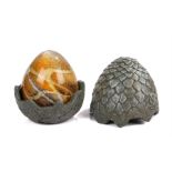 Ed Sheeran's Game of Thrones Dragon egg, with a grey scale effect body enclosing the egg, 14cm high.