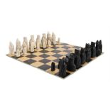 Ed Sheeran's chess set, styled as medieval figures, black and white, together with board. All of the