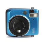 Ed Sheeran's camera, Fuji Film Instax mini 70, in aqua blue. All of the Ed Sheeran Collection has