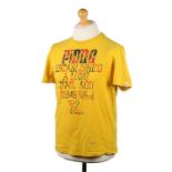 Ed Sheeran's t-shirt, Puma, in yellow with text, size M. All of the Ed Sheeran Collection has come