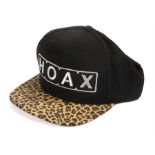 Ed Sheeran's baseball cap, signed to the card interior, HOAX in stitched white with black and