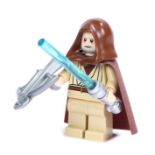 Ed Sheeran's Lego Star Wars figure, Obi-wan Kenobi, with a blue light sabre and crossbow . All of