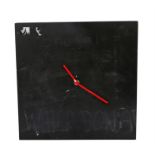 Ed Sheeran's wall clock, Karlsson, with red hands slightly bent and signs of chalk writing to the