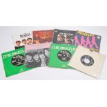 A collection of eight Beatles 7” singles, UK and European issues