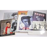 A set of eight Elvis Presley decorative metal wall signs, mostly sealed, 16”x12”.