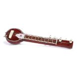 Ed Sheeran novelty toy instrument, a strung instrument, 16.5cm long. All of the Ed Sheeran