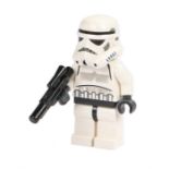 Ed Sheeran's Lego Star Wars figure, Storm Trooper, with a blaster. All of the Ed Sheeran