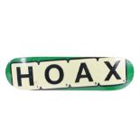 Ed Sheeran's Hoax skateboard board, natural wood top with Hoax underneath with green edge. All of