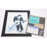 A classic 10 x 8” black and white photo of Chuck Berry duck-walking, boldly signed by him, with