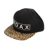 Ed Sheeran signed baseball cap, Hoax, white text with black top and leopard print front, signed to