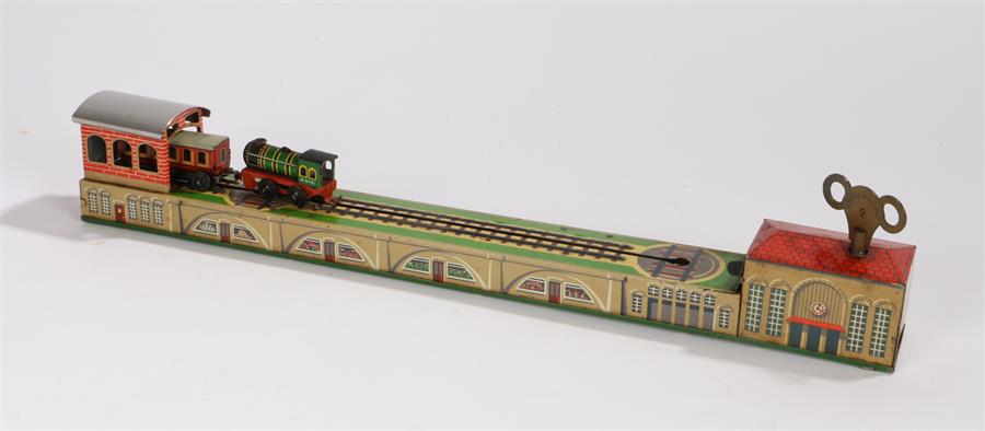 Tin plate clockwork novelty shunting train, the green tin printed locomotive with A570 to cab sides,