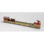 Tin plate clockwork novelty shunting train, the green tin printed locomotive with A570 to cab sides,