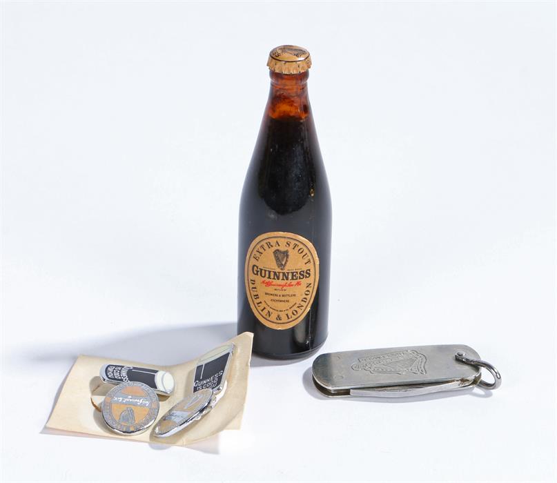 Guinness memorabilia, to include a miniature bottle, a pair of enamel cufflinks and a knife (4)