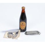 Guinness memorabilia, to include a miniature bottle, a pair of enamel cufflinks and a knife (4)