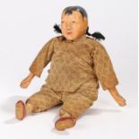20th century oriental doll with pigtails, 26cm high
