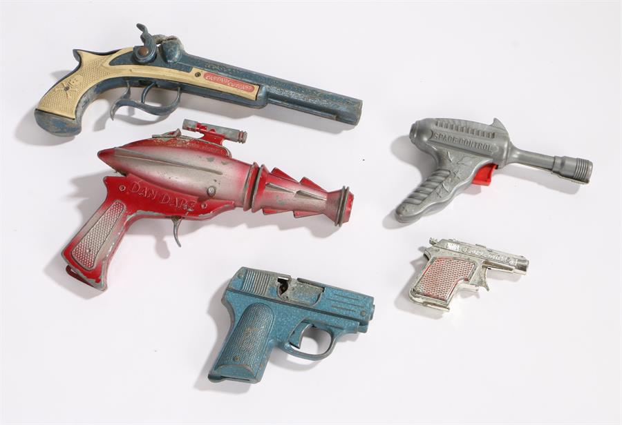 Toy guns to include Dan Dare's pistol, Captain Cutlass flintlock style pistol, Space Control plastic