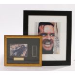 Jack Nicholson signed photograph, from a scene in the Shining, together with film cells from the
