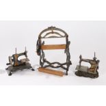 Child's model mangle, two children's sewing machines, the black bodies with floral decoration, (3)