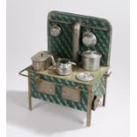 Tin plate toy oven with green brick effect splash back , central chimney, the hob with fish