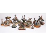 Collection of painted lead and resin figures depicting 19th century soldiers, the majority on