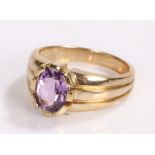 9 carat gold ring, set with a purple stone, ring size N