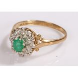 9 carat gold ring, with a green stone flower head design, ring size O