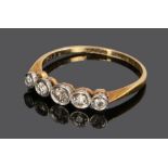 18 carat gold diamond set ring, with a row of five diamonds to the head, ring size P