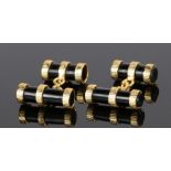 Pair of onyx and silver gilt cufflinks, with onyx tubes and gilt bands