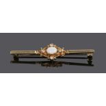 9 carat gold opal and diamond set brooch, with a central oval opal with four diamonds to the