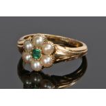 Emerald and pearl set ring, with a central emerald and pearl surround to form a flower head