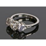 Platinum and diamond set ring, the central diamond weight at approximately 1.18 carat flanked by a