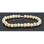 Japanese Meiji period ivory necklace, with ball links carved as a ball of mice, 49cm long