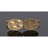 Pair of 9 carat gold cufflinks, with an oval disc attached to the hinged arm, 7.8 grams